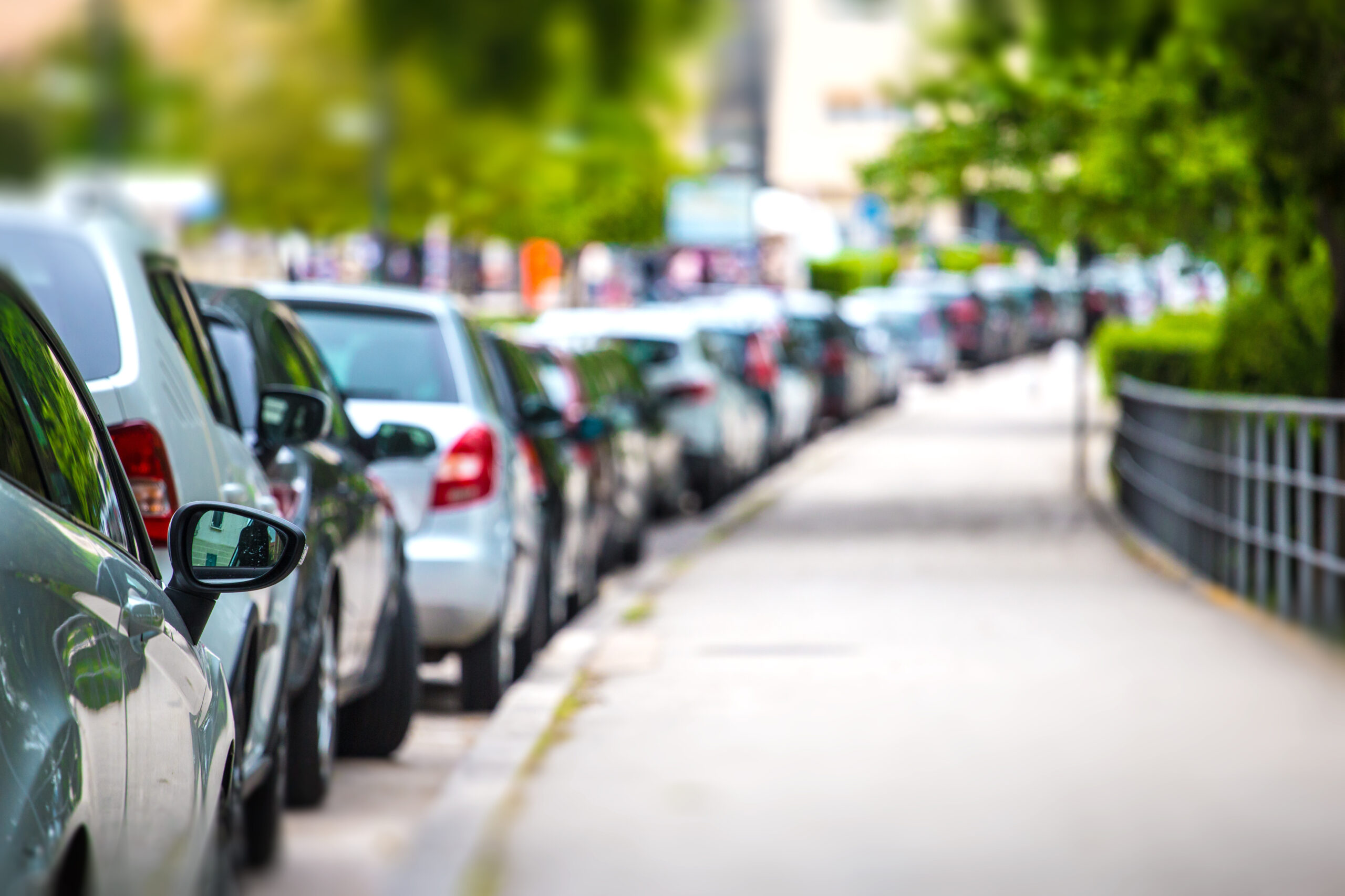 Cars parked next to a sidewalk